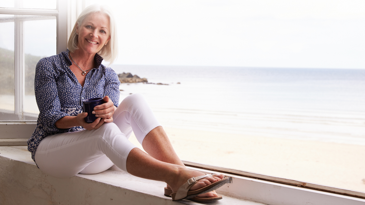 older woman sitting on windowsill.jpg