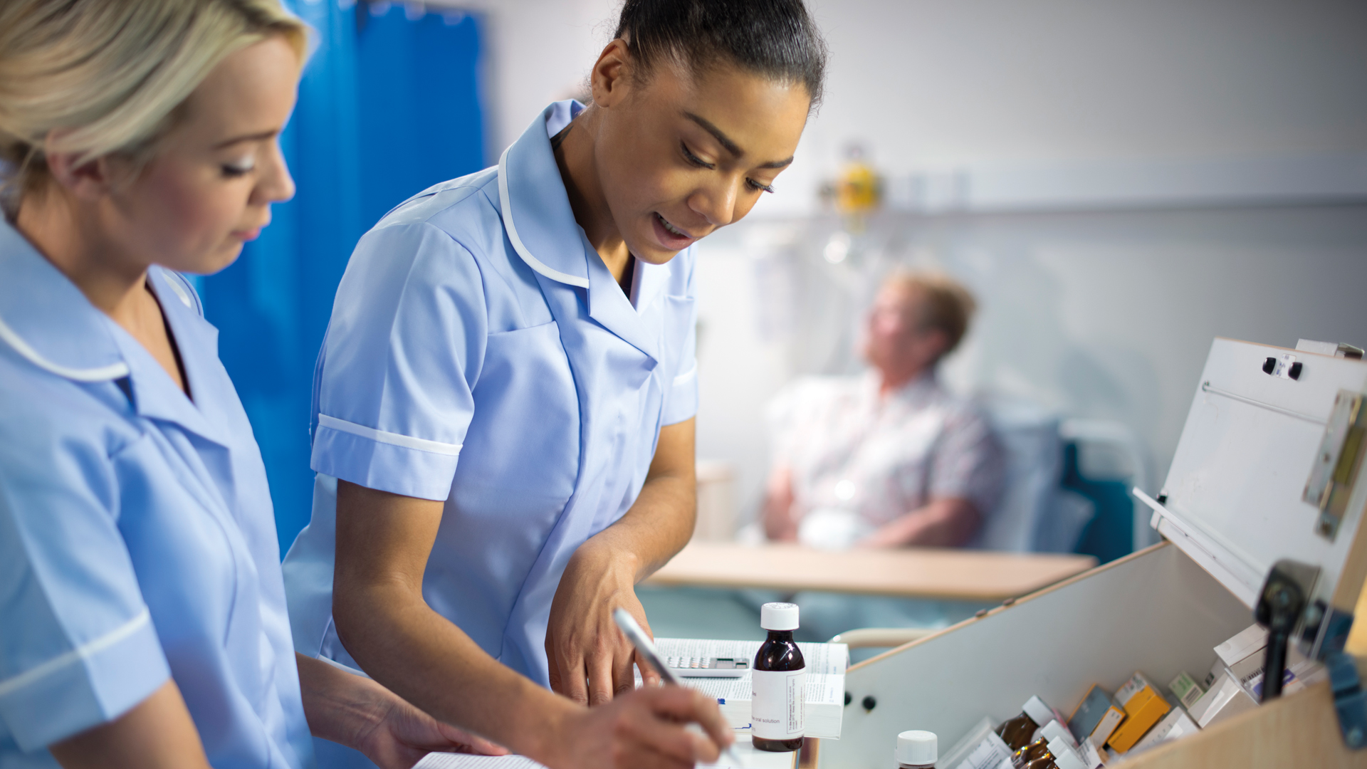 nurses checking records.jpg