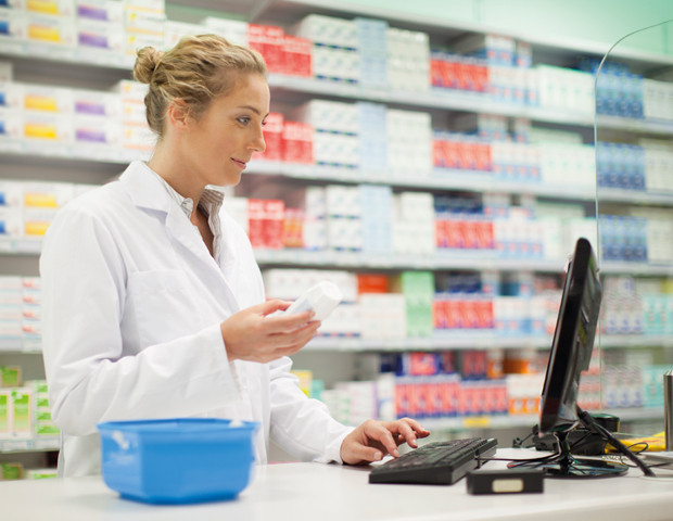 pharmacist checking medication computer_sum.jpg